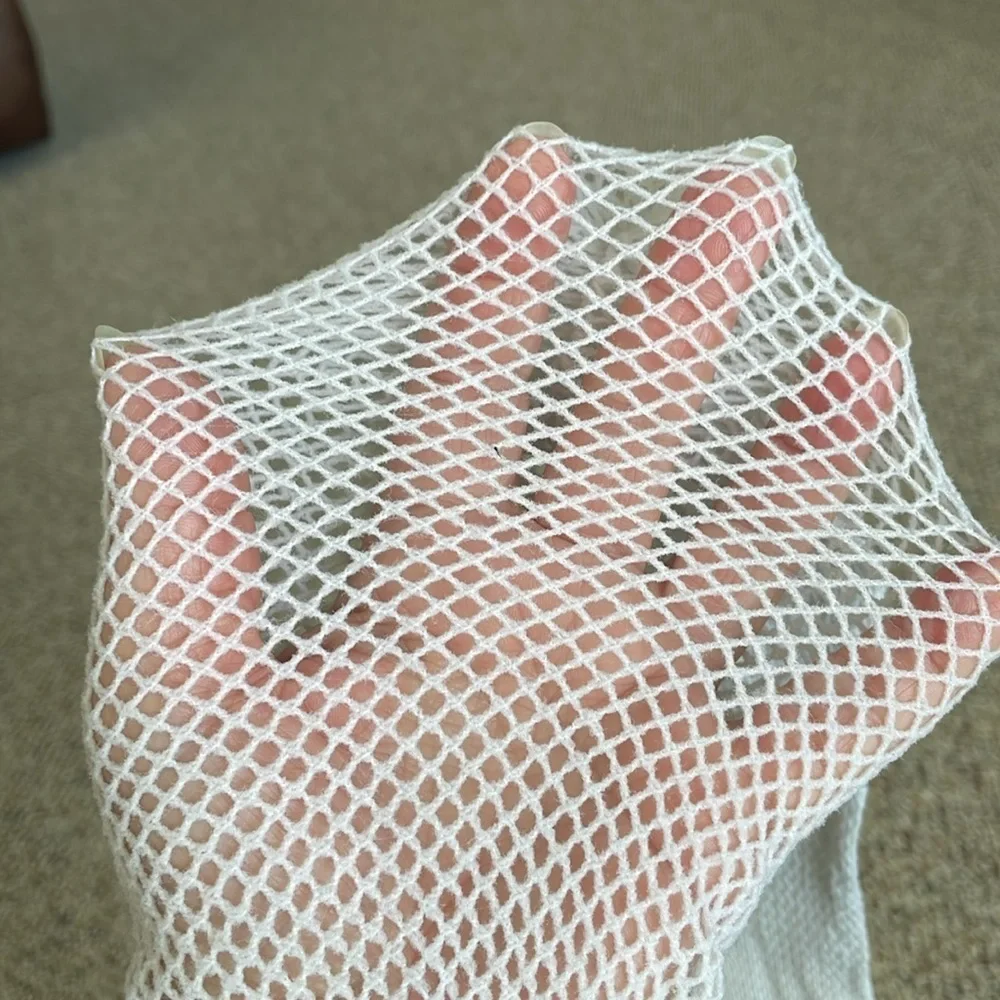 Pair Of Mismatched Fishnet Thigh High’s